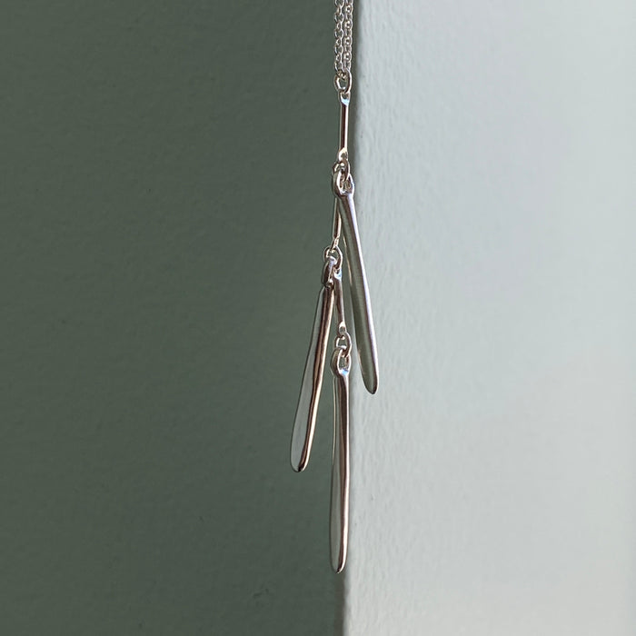 three needles. necklace: Silver