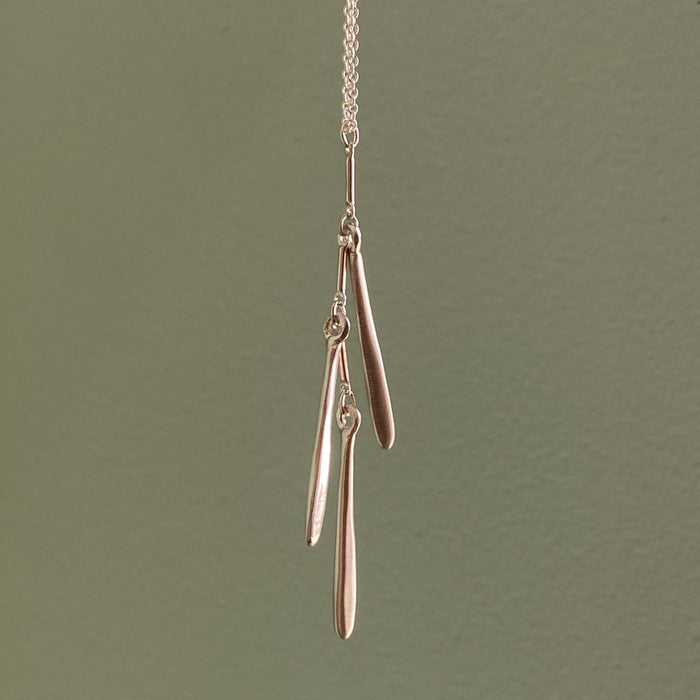 three needles. necklace: Silver