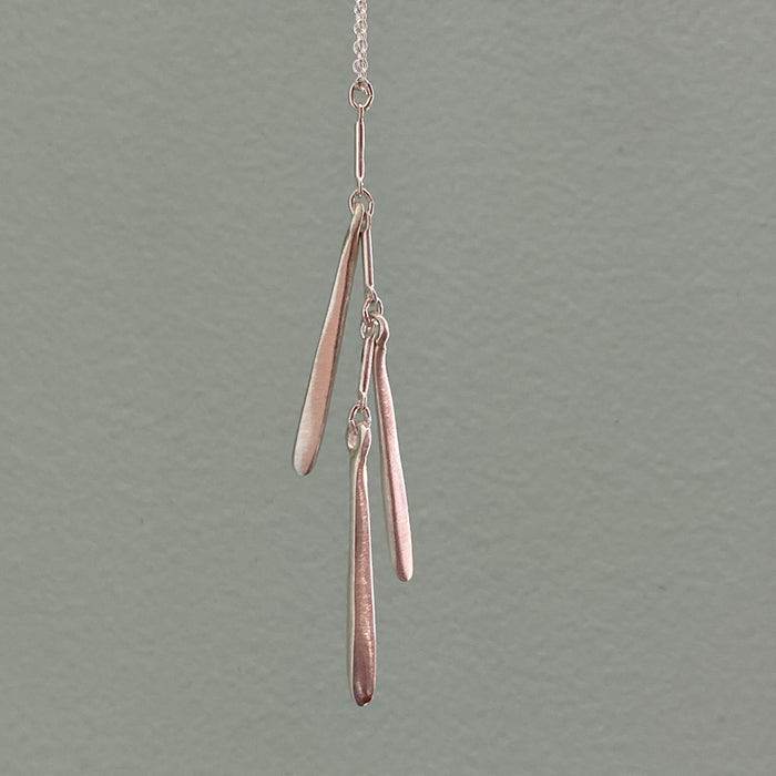 three needles. necklace: Silver
