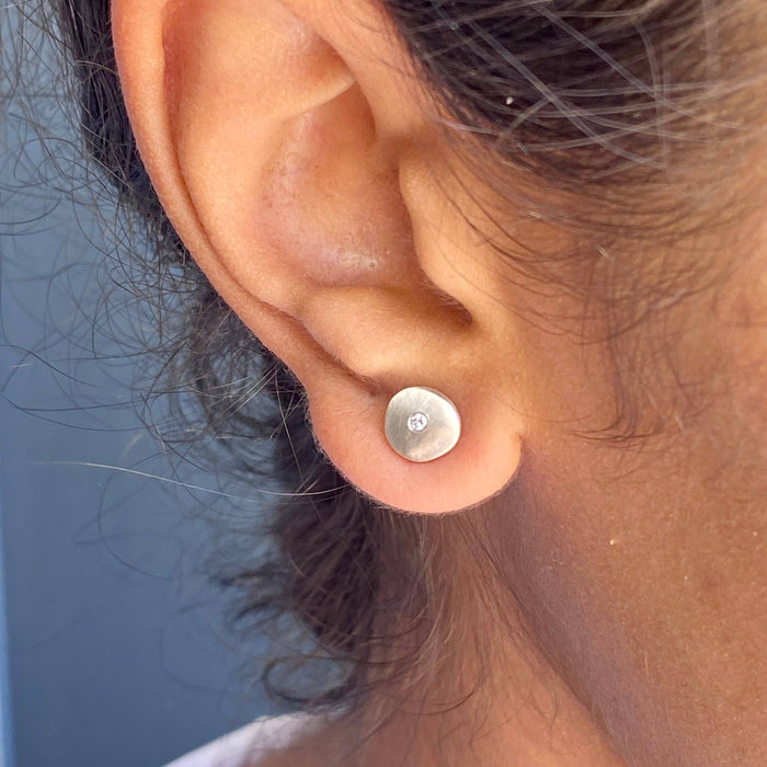 Tiny circular posts with ,02 ct diamond earrings: Silver