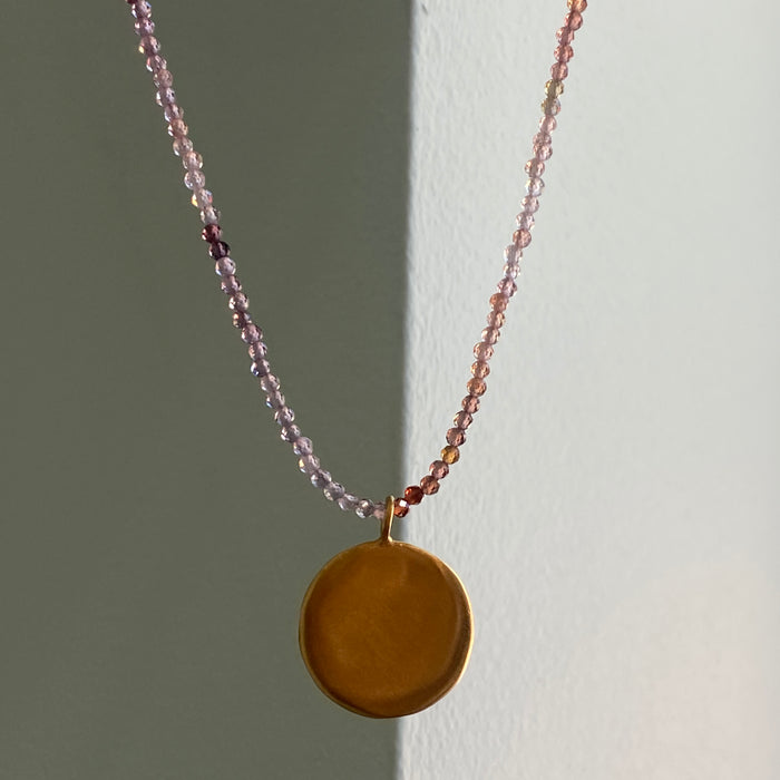 large disc on sapphire necklace