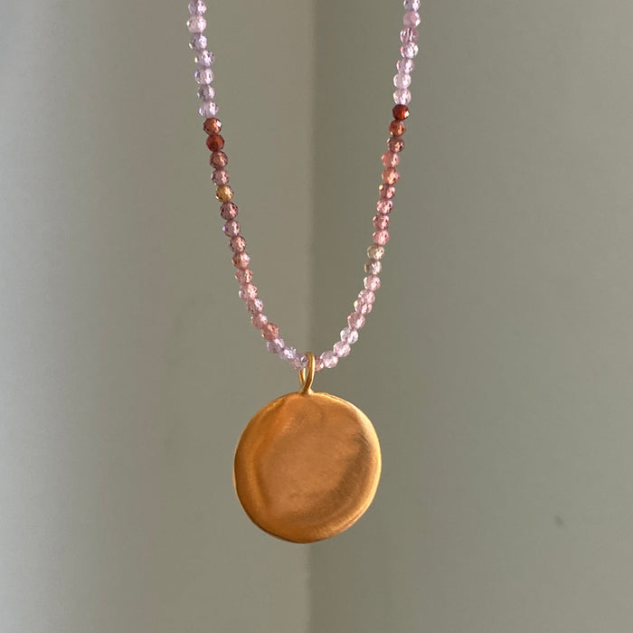 large disc on sapphire necklace